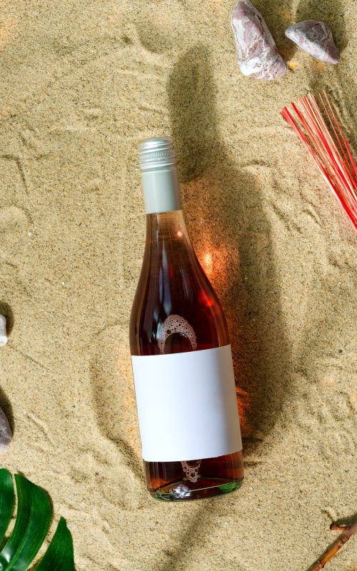 mockup-wine-bottle-on-a-beach.jpg